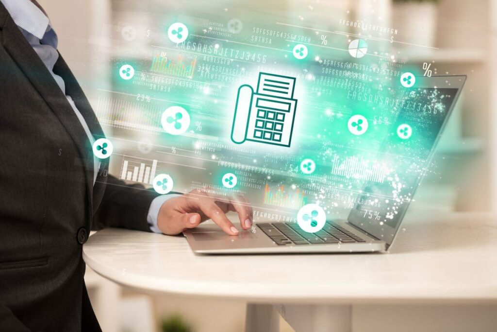 Man working on his laptop with a fax icon layered on top of it