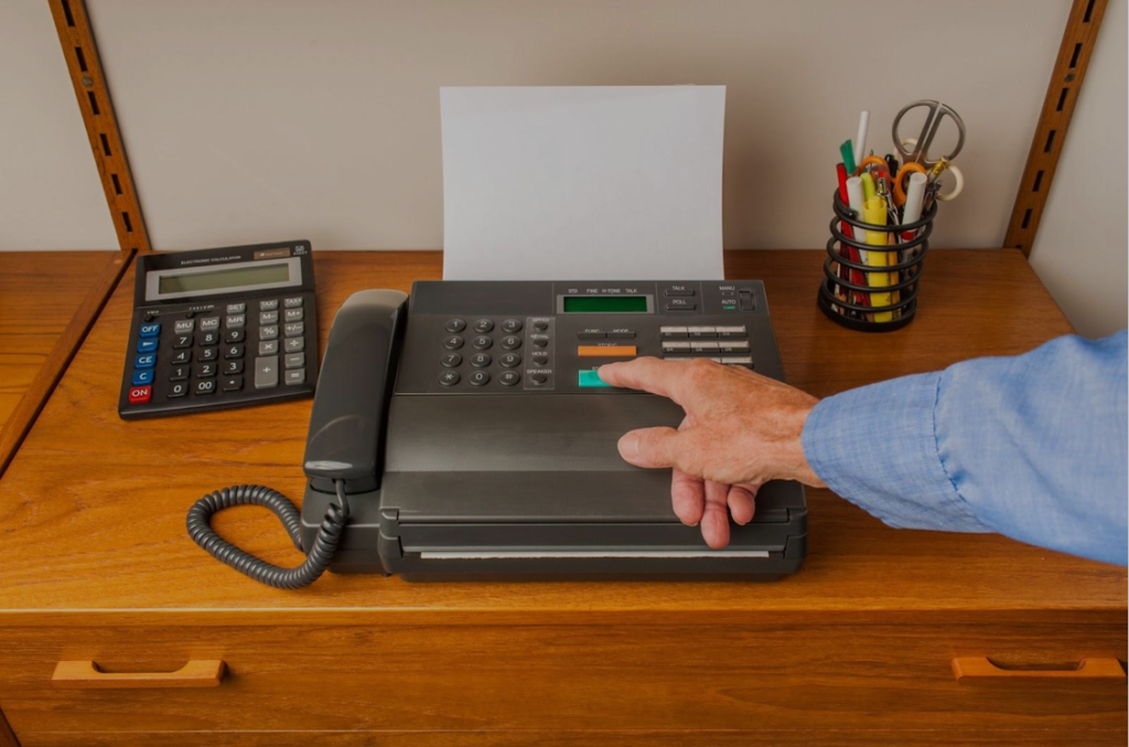 man faxing a document